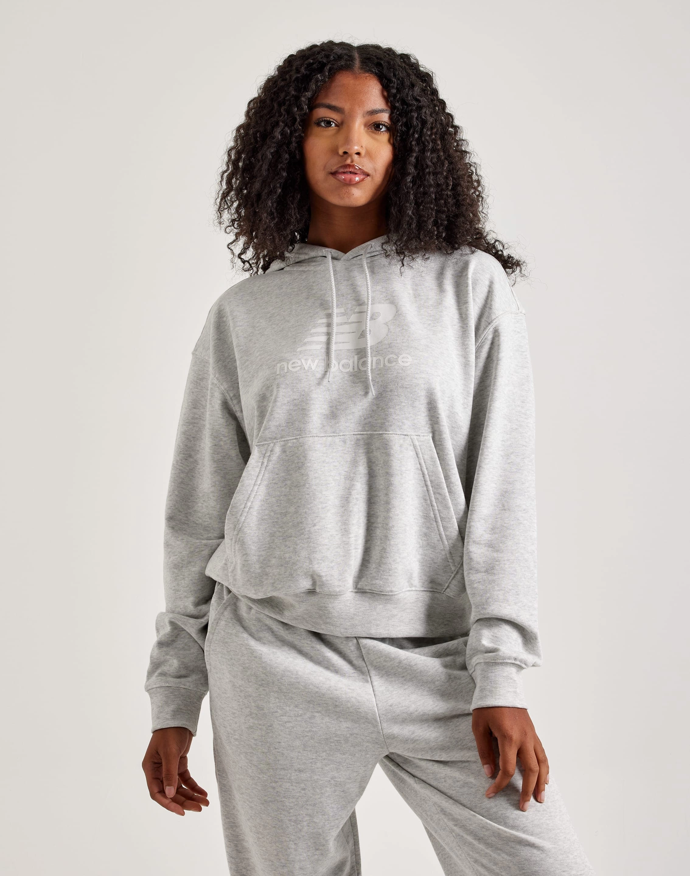 New Balance Sport Essentials French Terry Logo Hoodie New Balance sneakers with cushioned midsoles